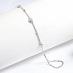luxury Stone Path Hand Chain Bracelet in Sterling Silver and 18K White Gold with small crystals on a white background