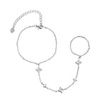 Sterling Silver hand chain bracelet with star-shaped charms on a white background