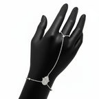 Hand Chain Bracelet in Sterling Silver and white gold on a black mannequin hand against a white background